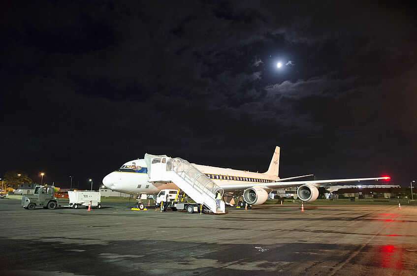 Early take off in Christchurch. The DC-8 with the moon in the background.