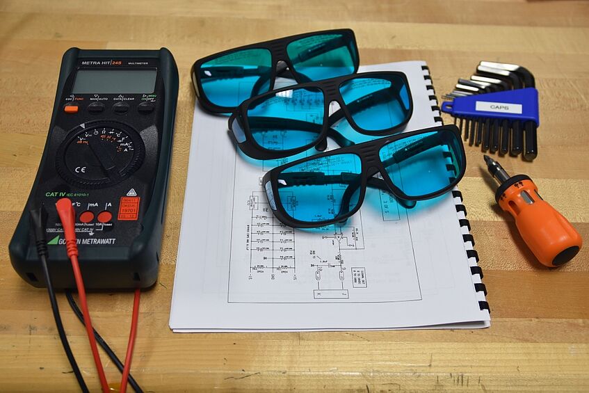 Voltmeter, laser goggles & circuit diagrams