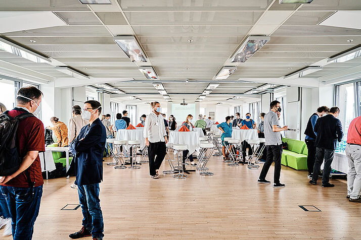 People waiting for the beginning of the ice breaker in the sky lounge.